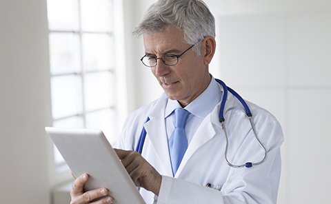 doctor examining reports
